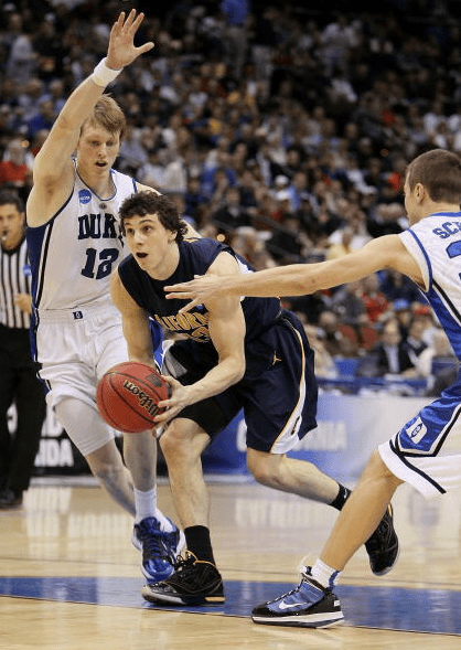 Kyle Singler #12 and Jon Scheyer #30 of the Duke Blue Devils tries to stop Nikola Knezevic #13 of the California Golden Bears during the second round of the 2010 NCAA men's basketball tournament at Jacksonville Veteran's Memorial Arena on March 21, 2010 in Jacksonville, Florida. - Andy Lyons/Getty